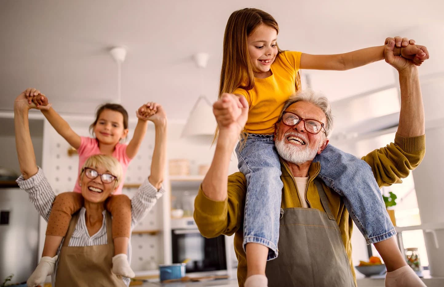 Grandparents with their granddaughters smiling